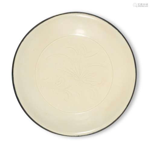 A carved 'Ding' 'lotus' dish, Northern Song dynasty | 北宋 定...