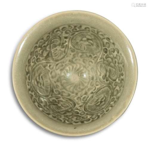 A molded 'Yaozhou' celadon-glazed 'floral' bowl, Northern So...