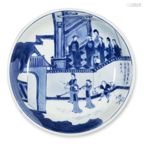 An inscribed blue and white 'figural' dish, Qing dynasty, ea...