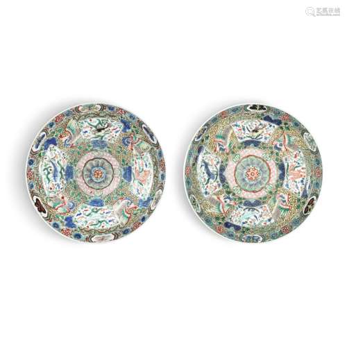 A pair of yellow-ground famille-verte 'four fish' dishes, Qi...