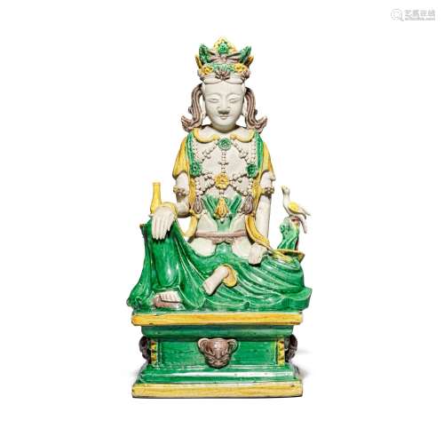 A famille-verte biscuit seated figure of Guanyin, Qing dynas...