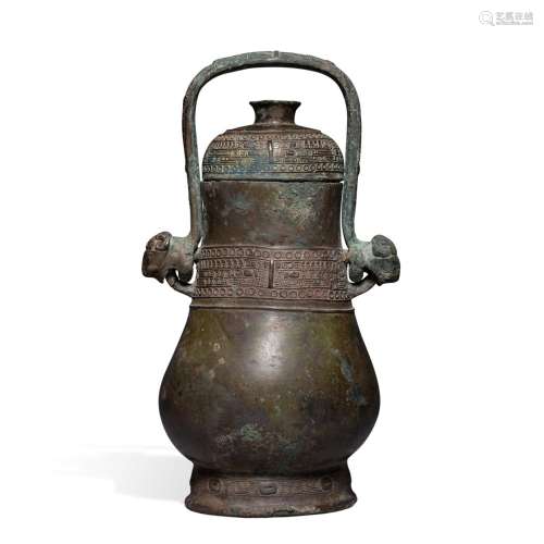 An archaic bronze ritual wine vessel and cover (Hu), Late Sh...