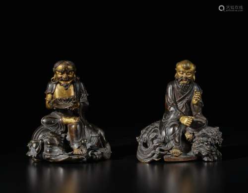 A rare pair of dated and inscribed parcel-gilt bronze figure...