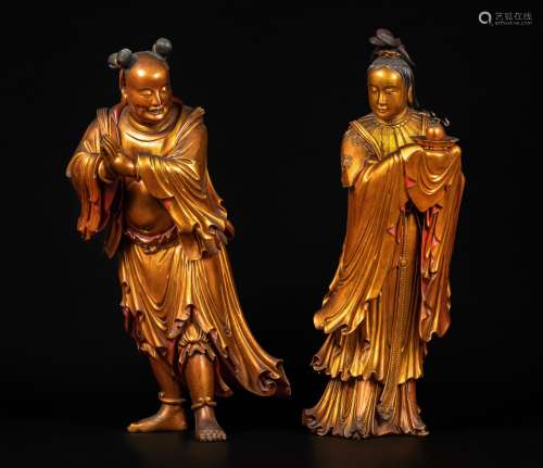 A pair of massive gilt-lacquered wood figures of acolytes, Q...