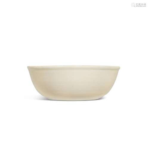 A carved 'Ding' white-glazed 'floral' bowl, Northern Song dy...