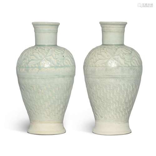 A rare pair of carved Qingbai 'lotus' vases, Southern Song d...