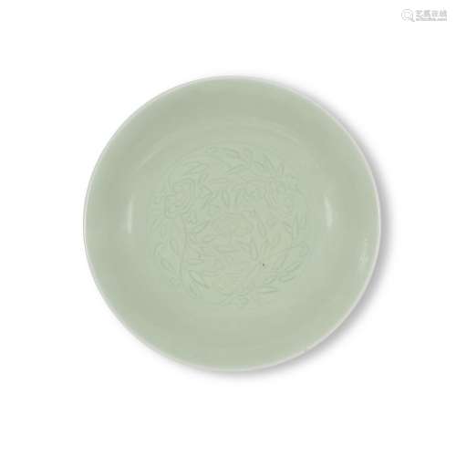 A carved celadon-glazed 'lingzhi' dish, Mark and period of Y...