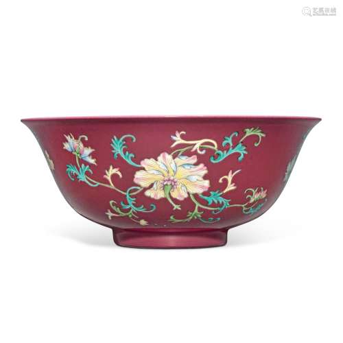A rare ruby-ground famille-rose 'floral' bowl, Qing dynasty,...
