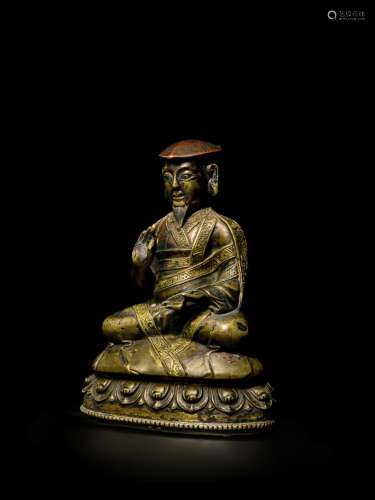 A COPPER AND SILVER INLAID BRASS FIGURE OF CHOKYI PALSANG TI...