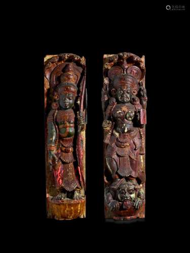 A PAIR OF CARVED POLYCHROME WOOD PANELS OF DEVI KERALA, CIRC...