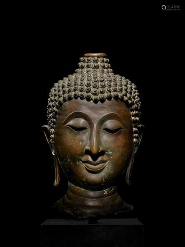 A LARGE COPPER ALLOY HEAD OF BUDDHA NORTHERN THAILAND, LAN N...