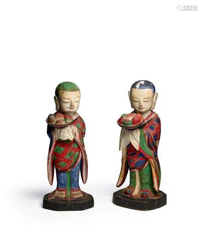 A PAIR OF IMPORTANT POLYCHROME WOOD FIGURES OF DONGJA (BUDDH...