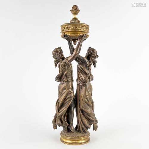 A large figurine of two graces, silver-plated and polished b...