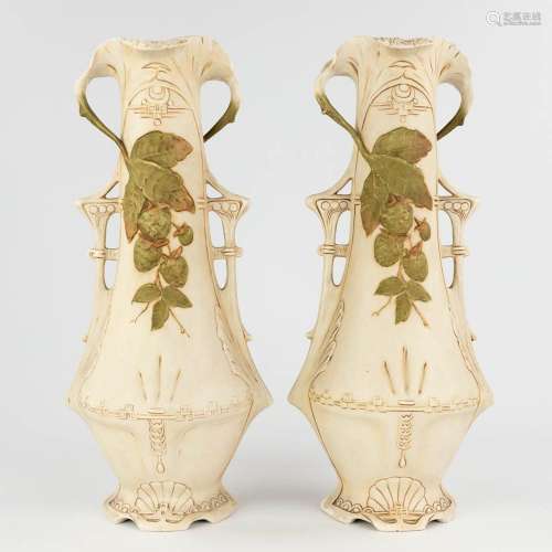 Royal Dux, a pair of faience vases, art nouveau. Circa 1900....