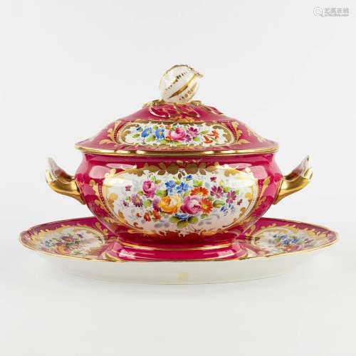 A polychrome porcelain tureen with a lid on a stand, hand-pa...