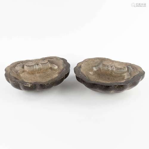A pair of wall-mounted holy water fonts, Belgian blue stone....