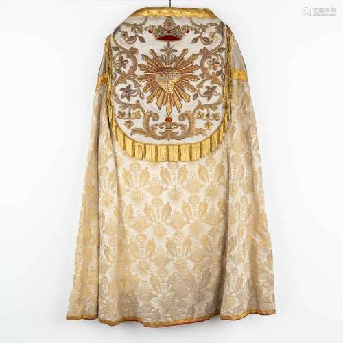 An antique cope, thick gold thread embroideries and decorate...