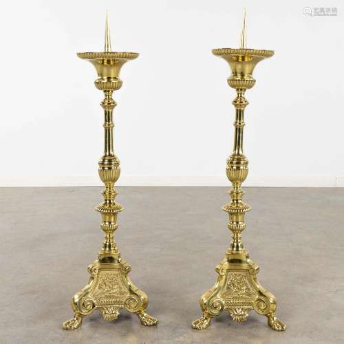 A pair of church candlesticks or candle holders polished bro...