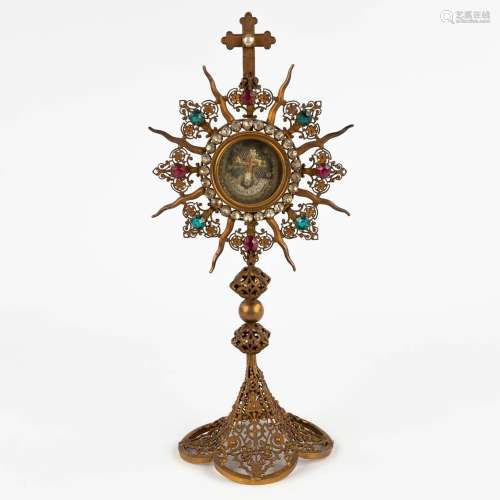 A sunburst monstrance with a relic 'S. Crucis D.N.J.C.', 19t...