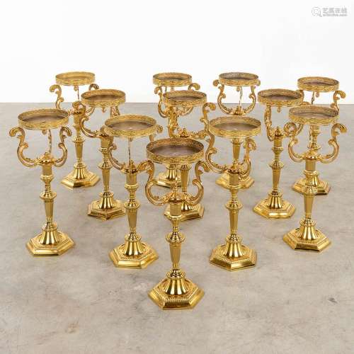 Twelve Church candlesticks. Gold-plated brass, 20th C. (H:53...