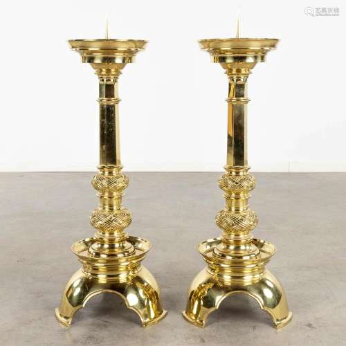 A pair of church candlesticks or candle holders polished bro...