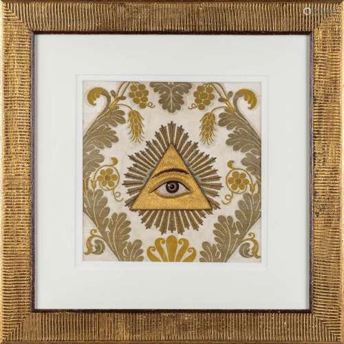 A framed 'Eye of Providence', thick gold-thread embroidery. ...