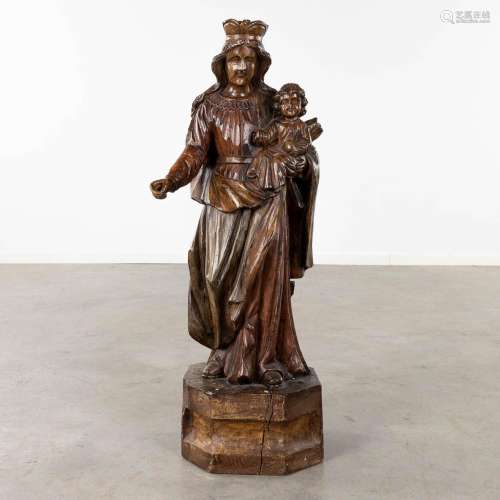 A large wood-sculptured figurine of Madonna. (D:28 x W:29 x ...