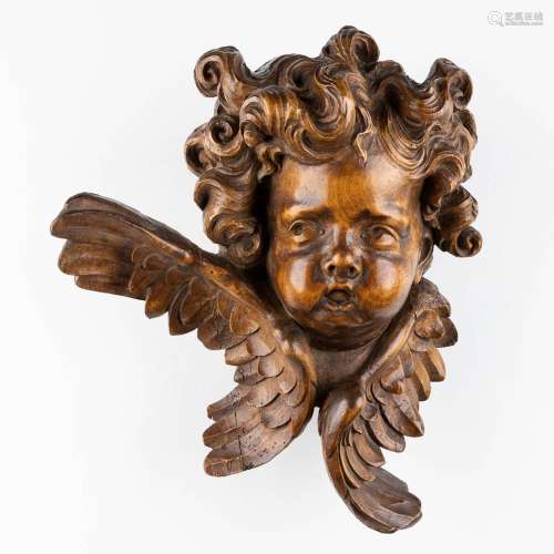 A wood-sculptured large head of an angel, Baroque style, 19t...