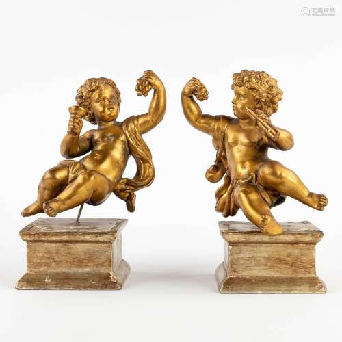 A pair of angels, gilt spelter and mounted on a wood base. 1...