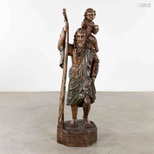 A large wood-sculptured figurine of Saint Christopher. Circa...