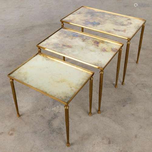 A set of 3 matching side tables with tinted glass, in the st...
