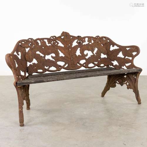 A cast-iron garden bench, decorated with fern leaves. 20th C...