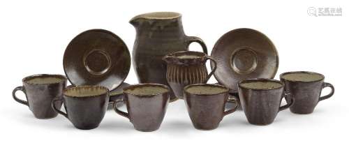 Leach Pottery<br />
<br />
Tenmoku jug, a cream jug and six ...