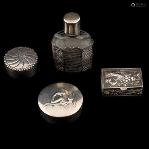 Three boxes and silver perfume bottle