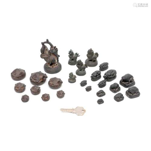 Twenty five small Asian sculptures (opium weights)