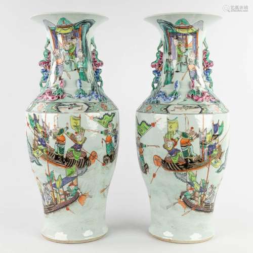 A pair of Chinese Famille Rose vases decorated with warriors...
