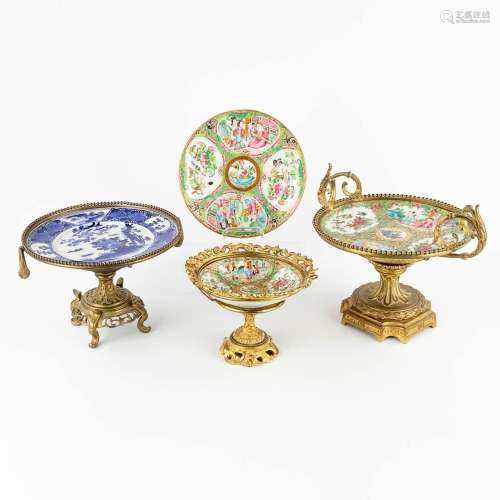 Three tazzas made of porcelain on a bronze base added a Kant...