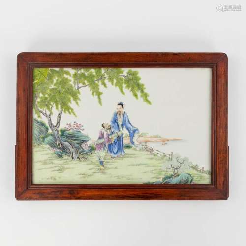A Chinese decorative table screen with porcelain plaque deco...