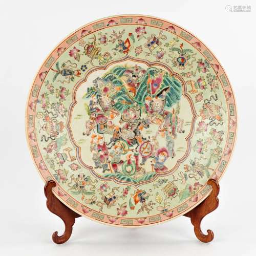 A Chinese Famille Rose plate, decorated with warriors, peach...