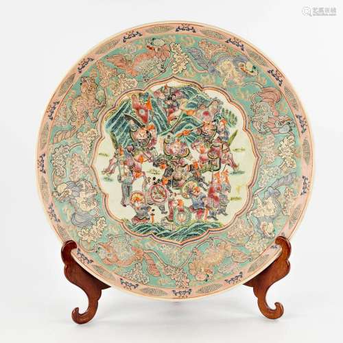 A Chinese Famille Rose plate, decorated with warriors, peach...