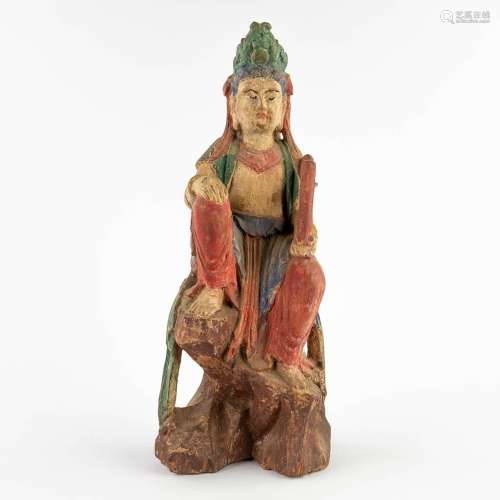 A Chinese sculptured figurine of Guan-Yin, polychrome decor....