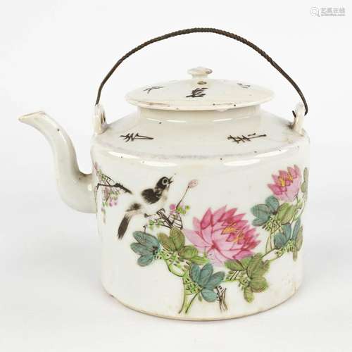 A Chinese tea pot decorated with birds and calligraphic text...