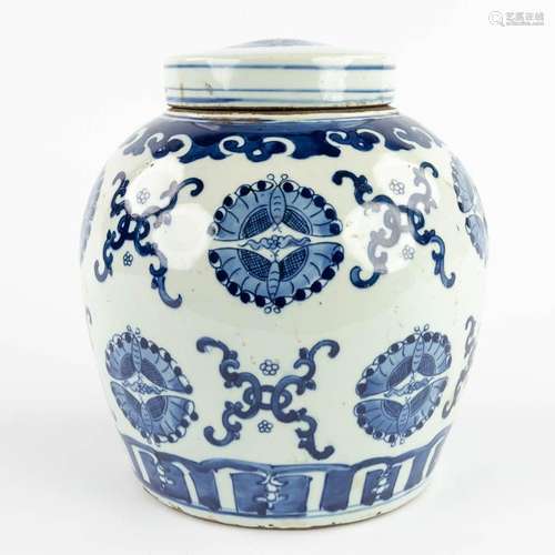 A large Chinese ginger jar, blue-white decor of butterflies....