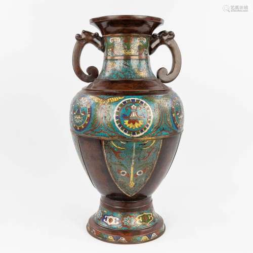 A large Oriental vase made of bronze with a champselvé decor...