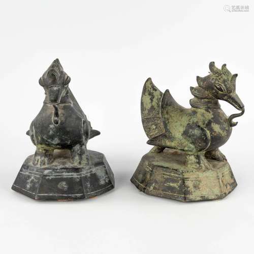 A pair of Oriental figurines, decorated with mythological fi...