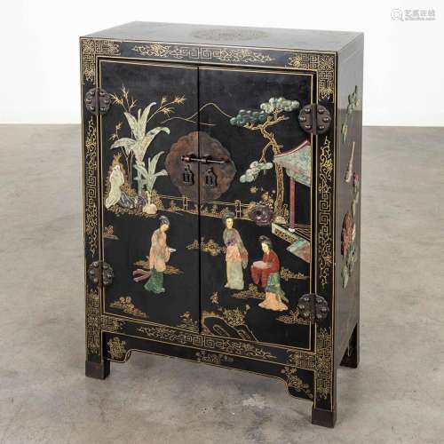 A Chinese cabinet inlaid with sculptured hardstone figurines...