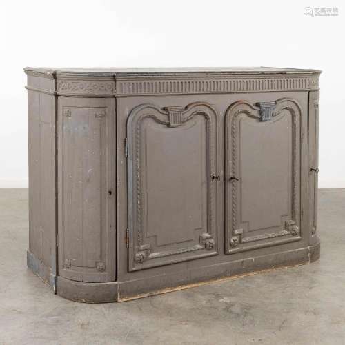 A sideboard with sculptured wood decorations, grey patinated...