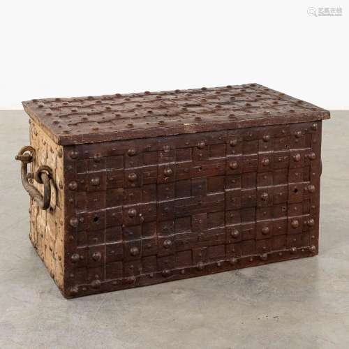 An antique metal chest in the style of Nuremberg chests, wit...