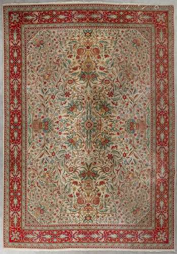 An Oriental hand-made carpet, Tabriz. (D:354 x W:254 cm)