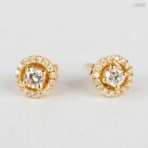 A pair of earrings, 18kt yellow gold with diamonds, appr. 0....